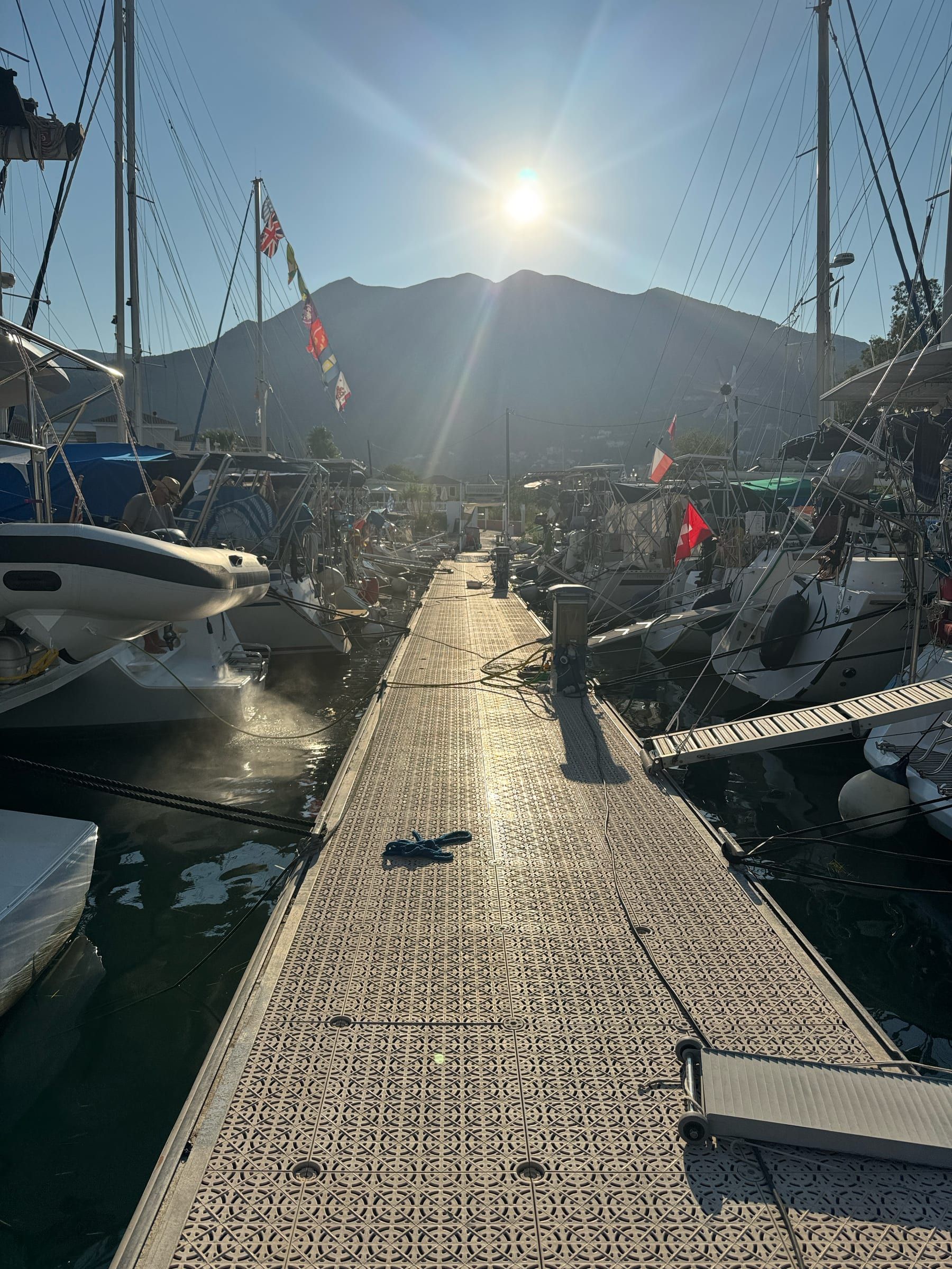 Sailing yachts moored at Iris Premium Pontoon in Nydri